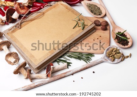 Different spices and cutting board, isolated on white