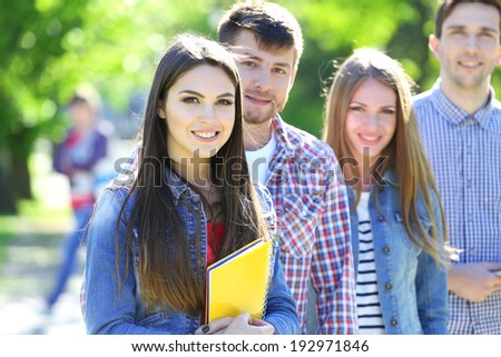 Happy students in park
