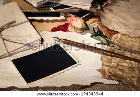 Composition with blank old photos, paper, letters on sackcloth background