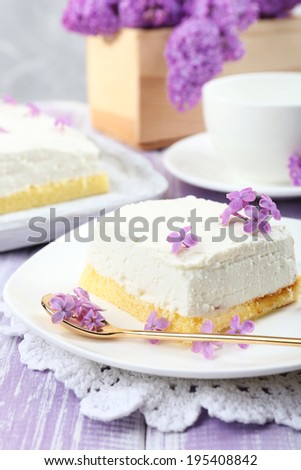 Delicious dessert with lilac flowers