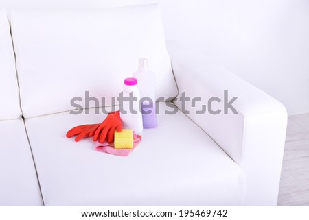 Cleaners for upholstered furniture on sofa close-up