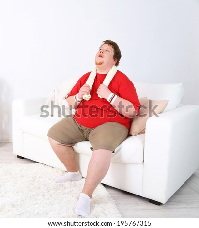 Large fitness man working out  at home