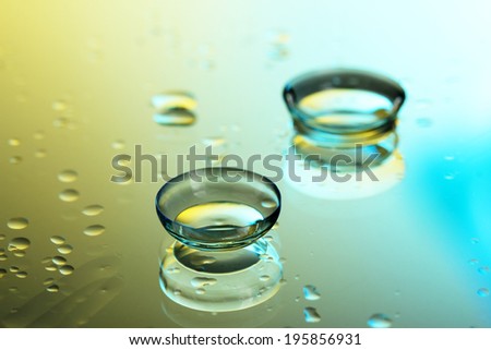 contact lenses, on yellow-blue background