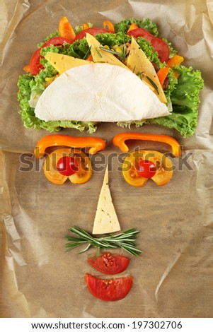 Veggie wrap filled with cheese and fresh vegetables on table