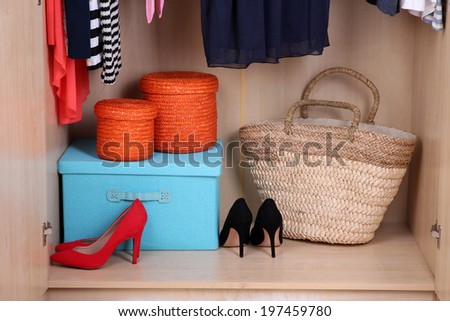 Female shoes and boxes in wardrobe
