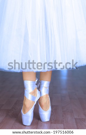 Ballerina in dance hall