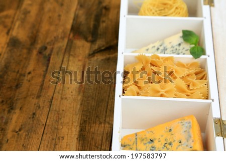 Italian products in wooden box on table close-up