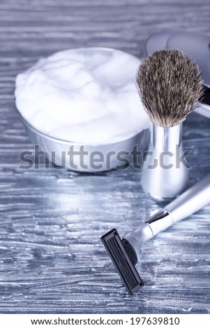Shaving accessories on gray background