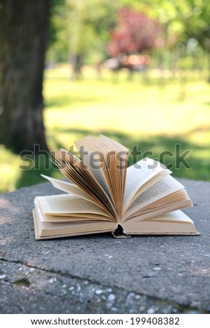 Open book in park outdoors