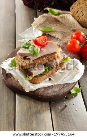 Delicious sandwiches with meet on table close-up