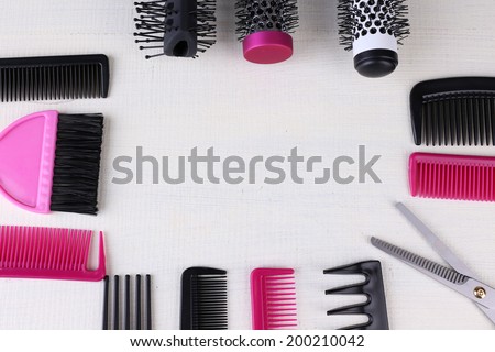 Professional hairdresser tools  on color wooden background