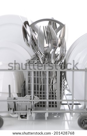 Clean dishes drying on metal dish rack, isolated on white