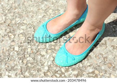 Female legs in beautiful shoes outside