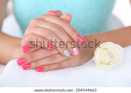 Beautiful woman hands on towel, close-up