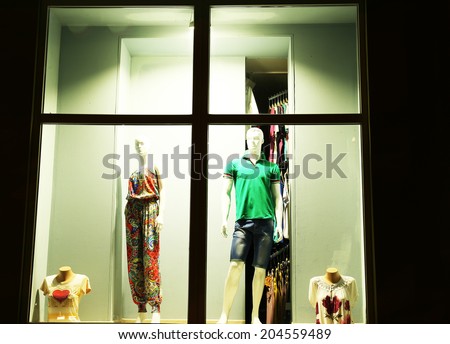 Fashion show in store window