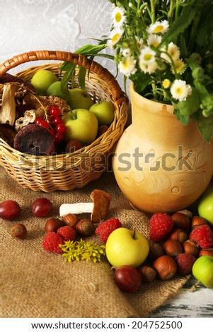 Still life with flowers and berries on wooden table