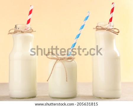 Bottles of milk on wooden table