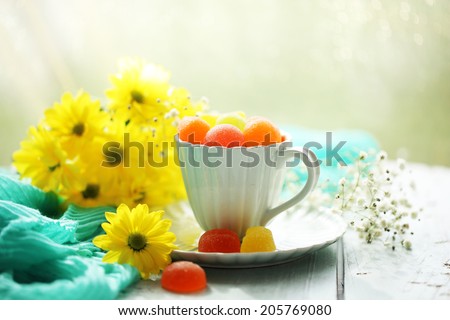 Jelly candies in cup on table close-up