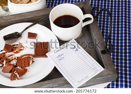 Check and remnants of food and drink on table close-up