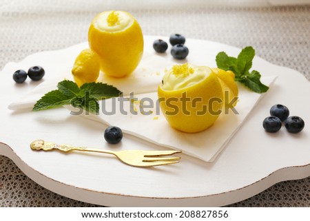 Tasty lemon dessert in lemon peel, close up
