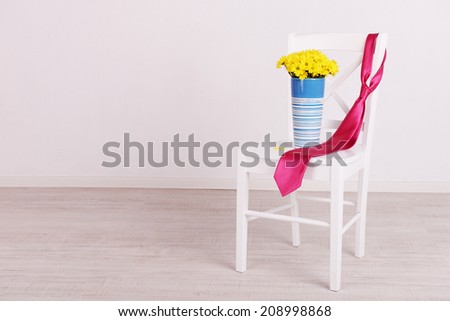 Bouquet of flowers and tie on Fathers Day in room