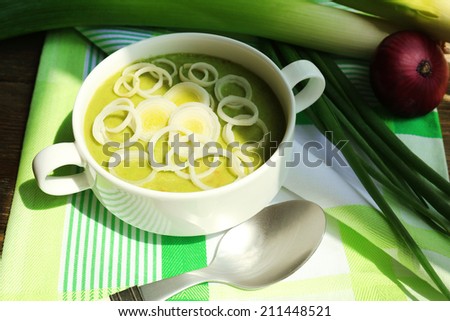 Leek soup on table, close up