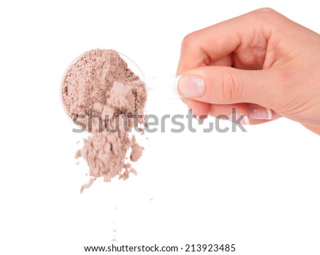 Female hand holding scoop with whey protein powder isolated on white