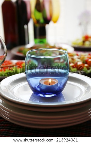 Restaurant table setting with candles