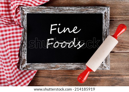 Fine foods written on chalkboard, close-up