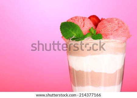 Tasty chocolate mousse with sorbet on pink background