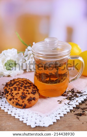 Cup of tea on table on light background