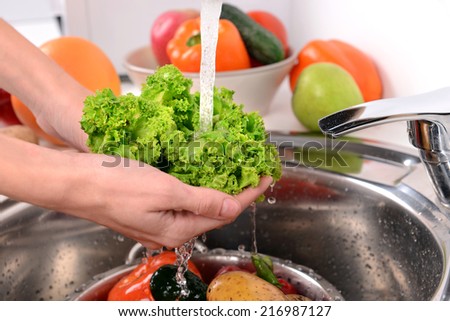 Washing fruits and vegetables close-up