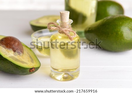 Avocado oil on table close-up