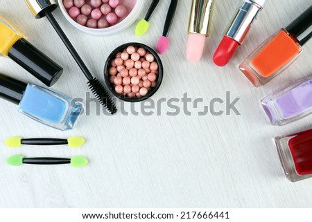 Beautiful decorative cosmetics and makeup brushes, isolated on white