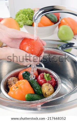 Washing fruits and vegetables close-up