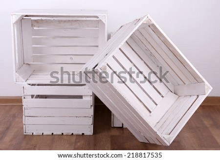 Empty wooden crates in room