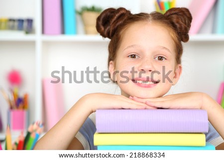 Cute girl at workplace in classroom