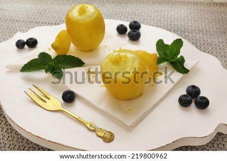 Tasty lemon dessert in lemon peel, close up