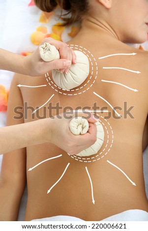 Back massage. Woman having back massage  (with arrows)