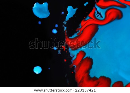 Spilled paint isolated on black