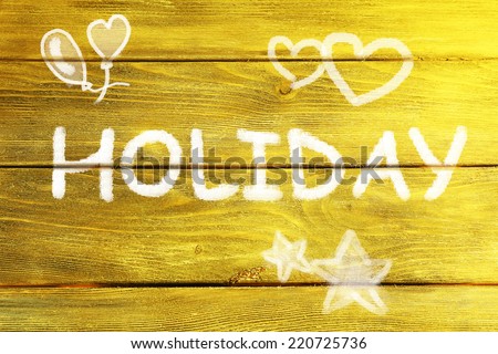 Holiday concept. Inscription on wooden wall background