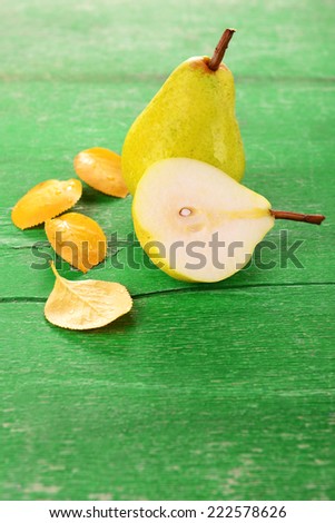 Ripe tasty pears on wooden table