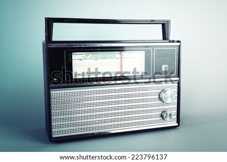 Old radio set on blue background