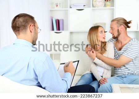 Young happy couple after therapy session with family psychologist