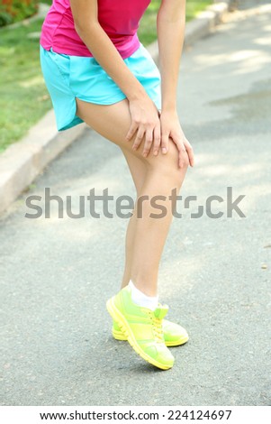 Sports injuries of girl outdoors
