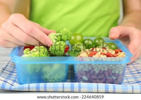 Woman making tasty vegetarian lunch, close up