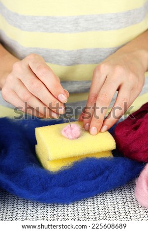 Woman working with wool close up