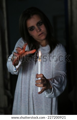 Horror Scene of with scary woman with candle