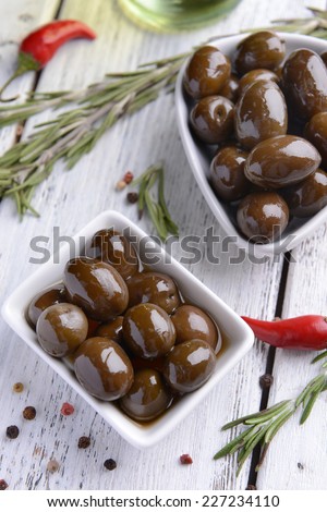 Marinated olives on table close-up