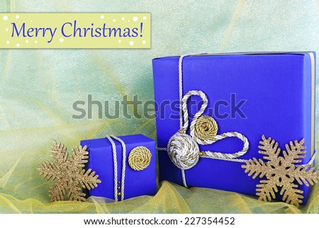 Dark blue gift boxes on yellow fabric background